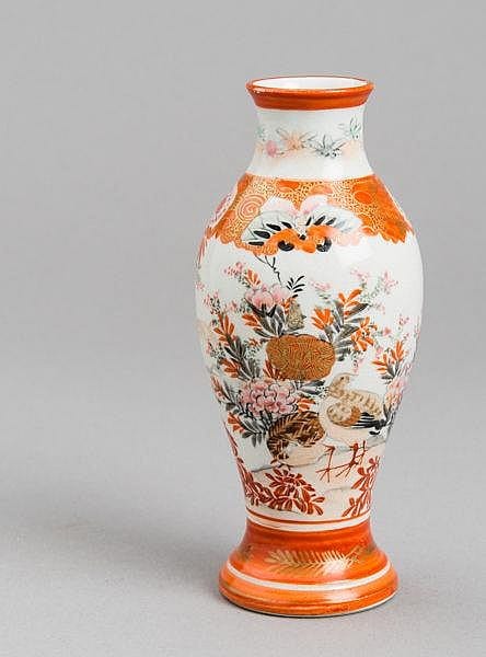 Small porcelain vase with orange rim and foot, decorated with floral motifs, a bird, and orange patterning on a white ground.
