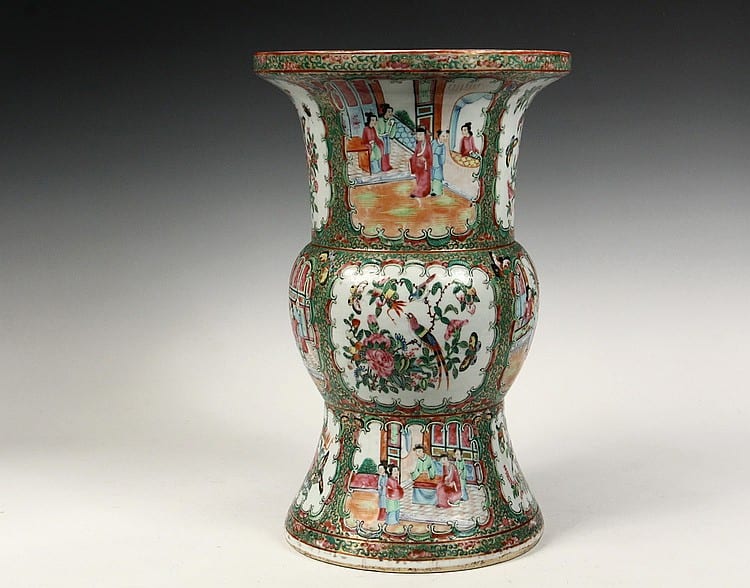 Colorful Chinese-style porcelain vase with an oval belly, flared rim, and painted figures and floral motifs in green, red, and gold tones.