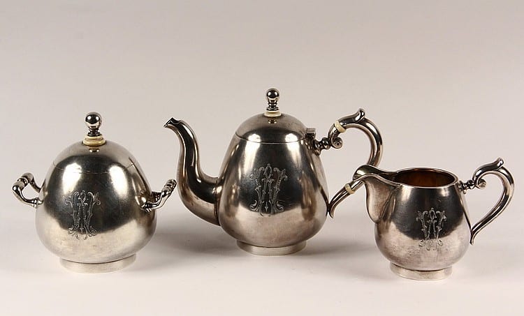 TEA SERVICE - Russian 84-Silver (3) Piece Tea Service with gilt washed interior, St. Petersburg 1893, assayer Alexander Sevier, probably by Erik August Kollin. 35.82 ozt tw. sold by Thomaston Place Auction Galleries, lot 1188 — auction record photograph