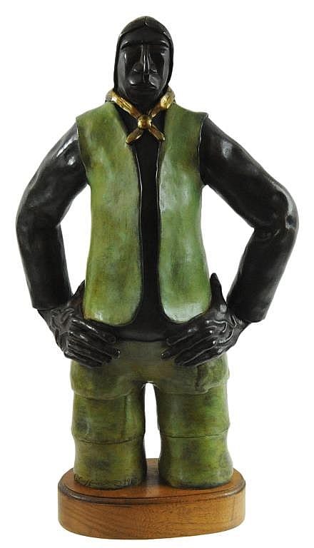 Bronze-like figurine of a standing man with hands on hips, black facial hair and a green vest and pants, on a wooden base.