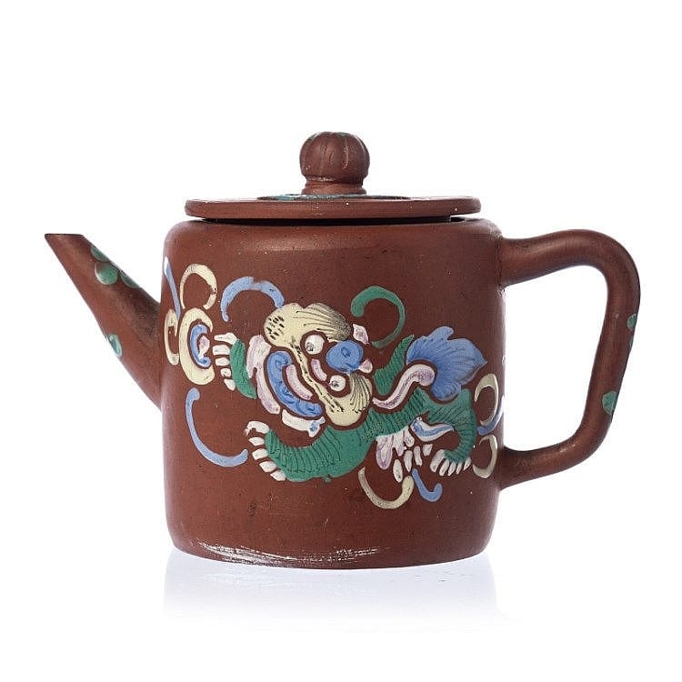 Brown ceramic teapot with a domed lid, curved spout, side handle, and painted colorful mythic dragon decoration.