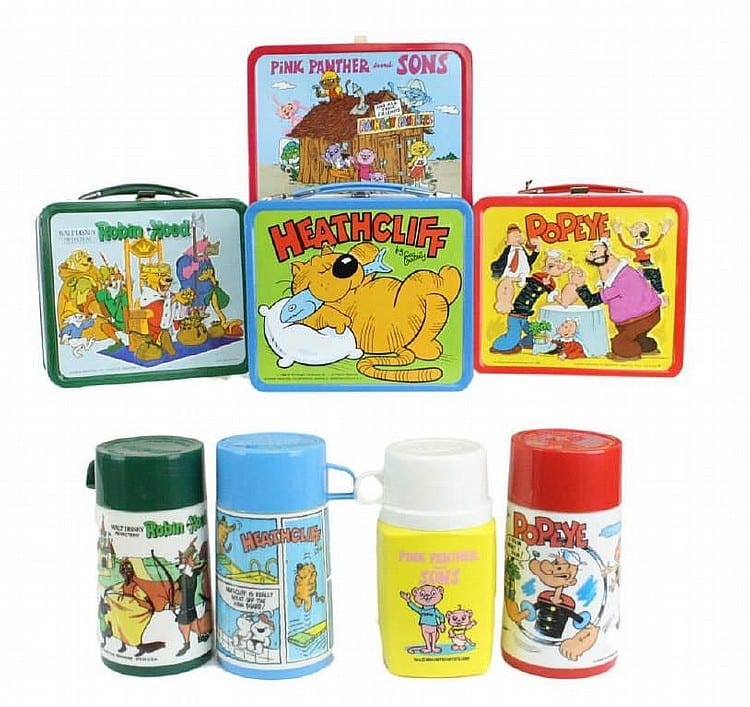 Four vintage lunch containers and bottles featuring cartoon characters, including Popeye and Heathcliff, arranged in two rows on a light background.