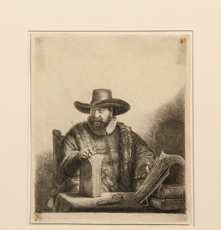 Etching print showing a seated bearded man wearing a wide-brimmed hat, holding papers at a table.