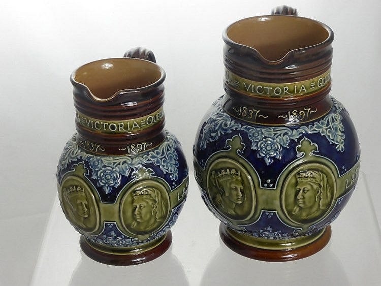 Two Doulton Lambeth Stoneware Jugs, commemorating sold by British Bespoke Auctions, lot 182 — auction record photograph
