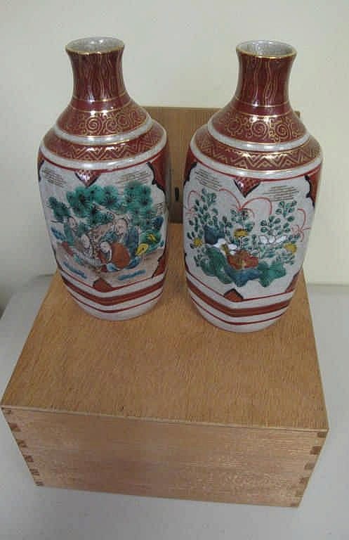 Pair Japanese Kutani sake bottles in original box measure 17cms high sold by Lugosi Auctioneers & Valuers, lot 95 — auction record photograph