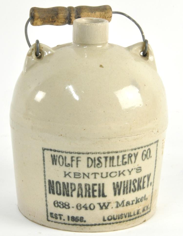 Wolff Nonpareil Whiskey Stoneware Jug sold by Mebane Antique Auction, lot 18 — auction record photograph