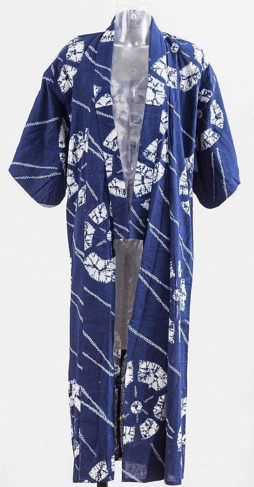 Blue and white patterned Japanese-style kimono displayed on a mannequin with a robe collar and wide sleeves.