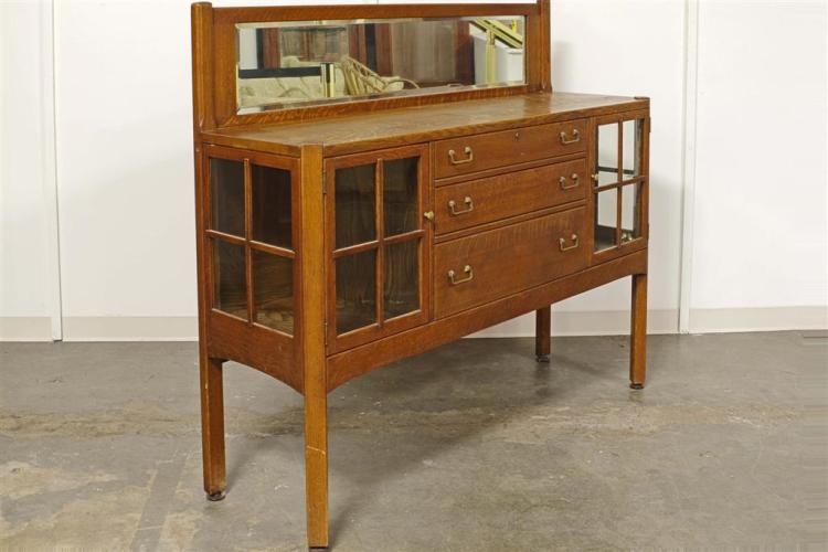 SIDEBOARD BUFFET - Antique Arts & Crafts style oak with rectilinear design, beveled mirror splashback, central stack of three drawer... sold by Pacific Galleries, lot 155 — auction record photograph