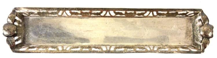 Rectangular silver-toned metal tray with raised molded edges and decorative end handles shaped like scrolls.