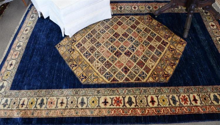 Kazak oriental rug, late 20th century. 5'5" x 8'. sold by Nadeau's Auction Gallery, lot 82 — auction record photograph