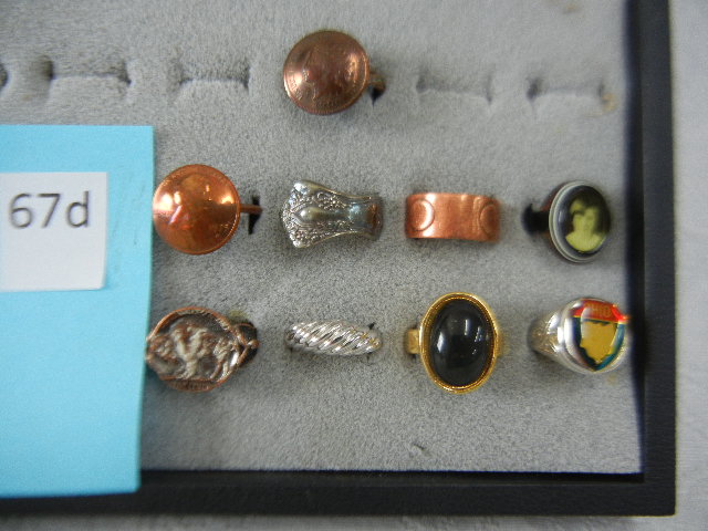 Lot of 9 Fashion Rings, Penny, Indian Head, Spoon, Ohio, Black Stone, Copper, Vintage Plastic Girl Photo Ring sold by Richard L. Edwards Auctioneer, lot 67D — auction record photograph