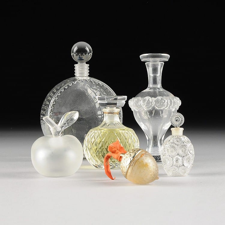 A COLLECTION OF LALIQUE CRYSTAL AND GLASS FIGURAL PERFUME BOTTLES, SIGNED, CIRCA 20TH CENTURY, sold by Simpson Galleries, LLC, lot 77 — auction record photograph