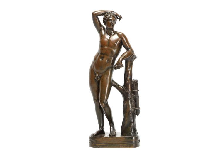 GIACOMO ZOFFOLI (ITALIAN, 1731-1785) AFTER THE ANTIQUE: AN 18TH CENTURY BRONZE FIGURE OF THE APOLLINO the nude figure with right arm raised and left arm leaning against a tree trunk hung with a quiver of arrows, on a shaped base, signed 'G. ZOFFOLI',  35cm high PROVENANCE: CHARLES AVERY COLLECTION Charles Avery is a specialist in European sculpture, particularly Italian, French, English, Flemish and Dutch. A graduate in Classics at Cambridge University, he obtained a Diploma in the History of Art at the Courtauld Institute and a doctorate for published work from Cambridge. Having been Deputy Keeper of Sculpture at the Victoria and Albert Museum for twelve years (1966-79), and a Director of Christies for ten years, since 1990 he has been a highly respected, independent historian, consultant, writer and lecturer. His books include Florentine Renaissance Sculpture, 1970, Giambologna the Complete Sculpture, Phaidon, 1987, Donatello: An Introduction, John Murray, 1994; Bernini, Genius of the Baroque, Thames and Hudson, 1997 (paperback, 2006),  and The Triumph of Motion: Francesco Bertos, 2008. Giacomo Zoffoli's workshop was the leading Roman foundry during the 18th century, and was famous for producing reductions in bronze after antique marbles of the very highest quality. We do not know exactly when the marble Apollino was discovered, but records show it was in the collection at Villa Medici by 1704 and prior to that had been in the Borghese collection. It remained in Rome until it was removed to accompany the Medici Niobe Group in 1769-70, and is now in the Uffizi, Florence.  A further reduction of this model by Zoffoli is in the Hermitage museum, acquired in 1933 from the Antikvariat All-Union Association, Inv. no. ?.??-1908, 33cm high.  Related Literature: Haskell & Penny 'Taste and the Antique' p.146-148. sold by Chiswick Auctions, lot 324 — auction record photograph
