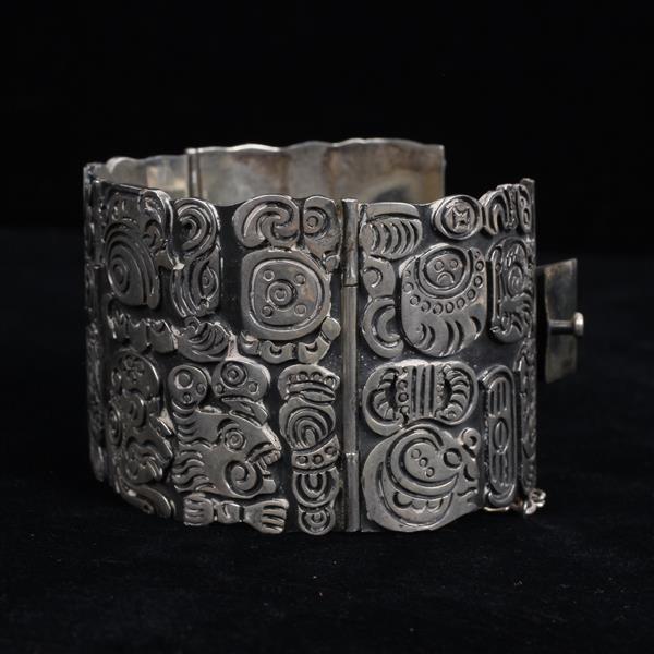 Los Ballesteros Taxco Mexican Modernist Sterling Silver WIDE Solid Link Bracelet / Cuff with embossed ancient tribal art. sold by Ripley Auctions, lot 210 — auction record photograph