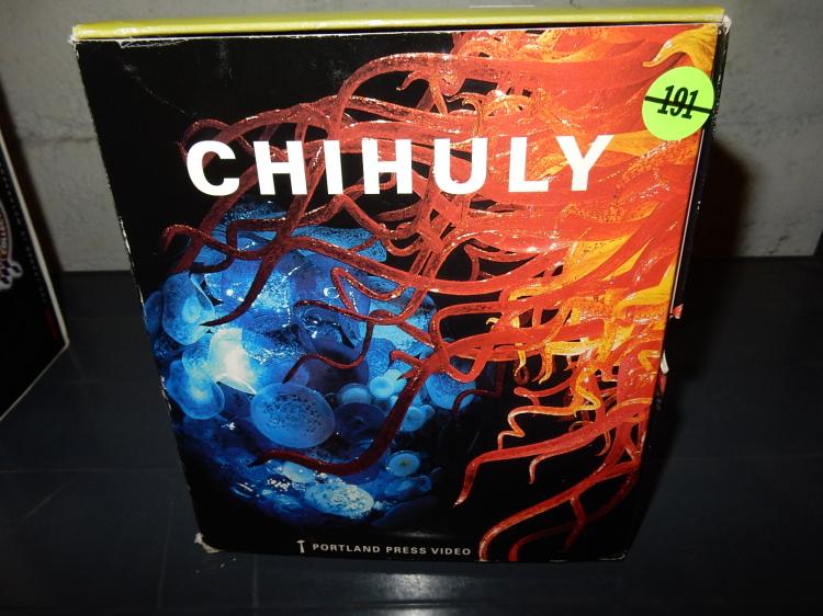 A black VHS tape case with large white “CHIHULY” lettering and orange-and-blue abstract art on the cover.