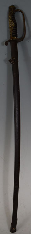 Long sword with dark brown scabbard and ornate gold-colored grip and guard, shown upright against a plain background.