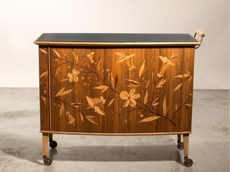 Erik Chambert comparable auction result: erik chambert 1902 1988 bar circa 1935 pi tement roulettes structure en bouleau et marqueterie d cor floral recouvert d un