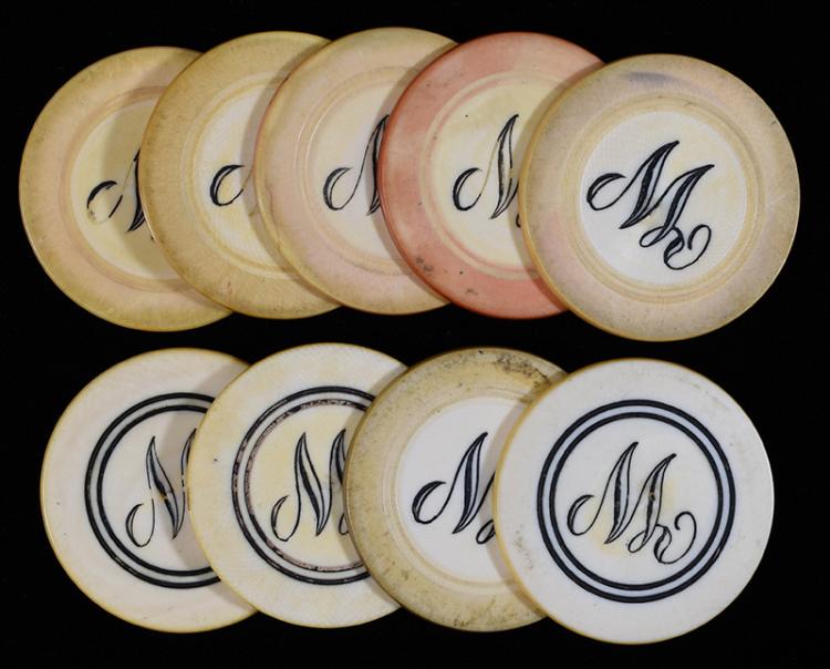 Nine off-white poker chips with engraved initials and curving line designs, laid out on a dark background.
