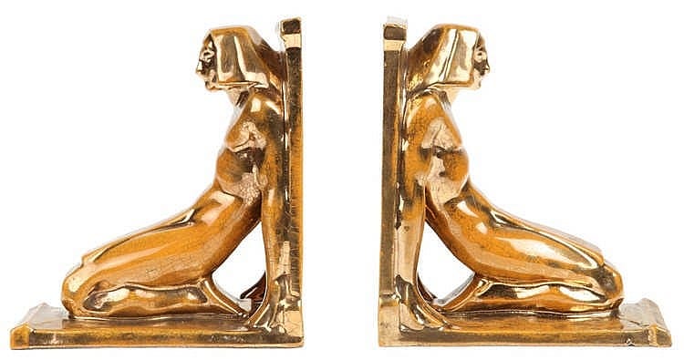 Emile Adolphe Monier comparable auction result: emile adolphe monier 1883 1970 a pair of book ends with decor of a kneeled egyptian figure gilt and brown glazed earthenware stamp boulogne and made in france