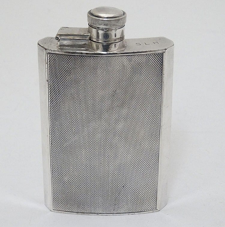 Abd al-Hadi al-Gazzar comparable auction result: a silver plate hip flask of shaped form with engine turned decoration by ja