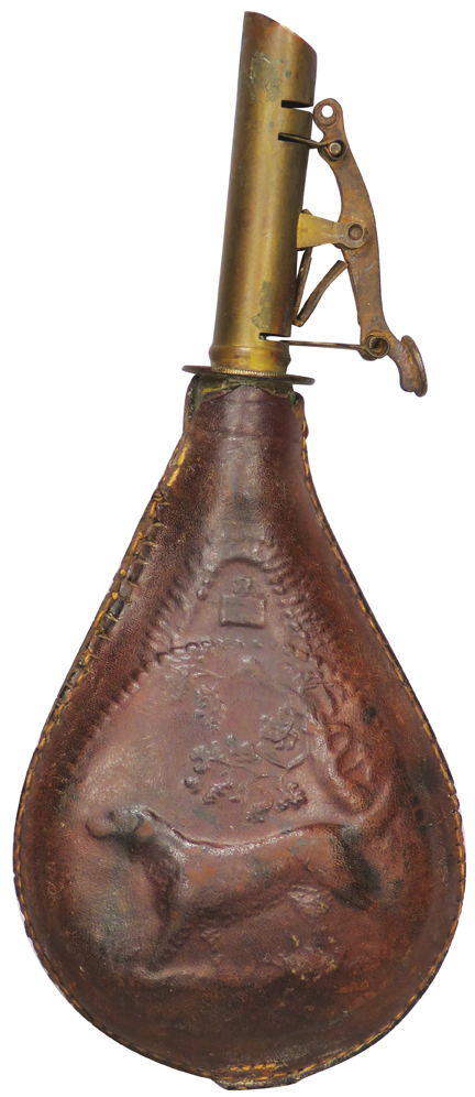 Antique-style brown leather powder flask with embossed designs and a metal spout and trigger-like cap mechanism.