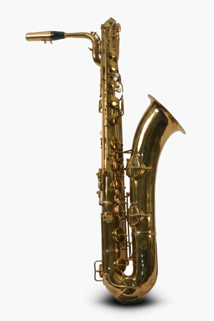 Gold-colored baritone saxophone standing upright against a white background.