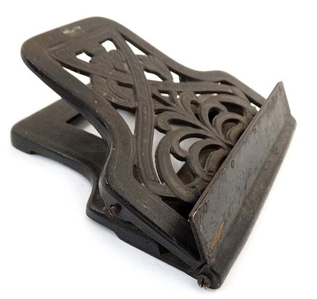 An Gu comparable auction result: an unusual black painted cast iron desk mounted gu