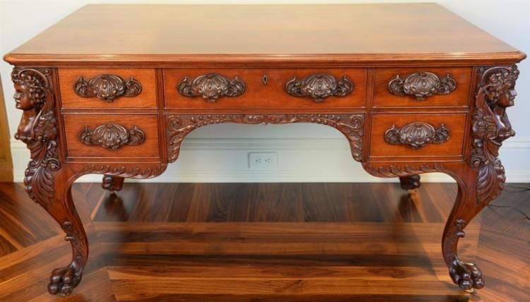 mahogany partners desk having female leg supports on cabriole legs ending in large paw feet and carved pulls having glass top sun f · Nadeau's Auction Gallery · 2018-01-01 F. Glass comparable auction result: mahogany partners desk having female leg supports on cabriole legs ending in large paw feet and carved pulls having glass top sun f
