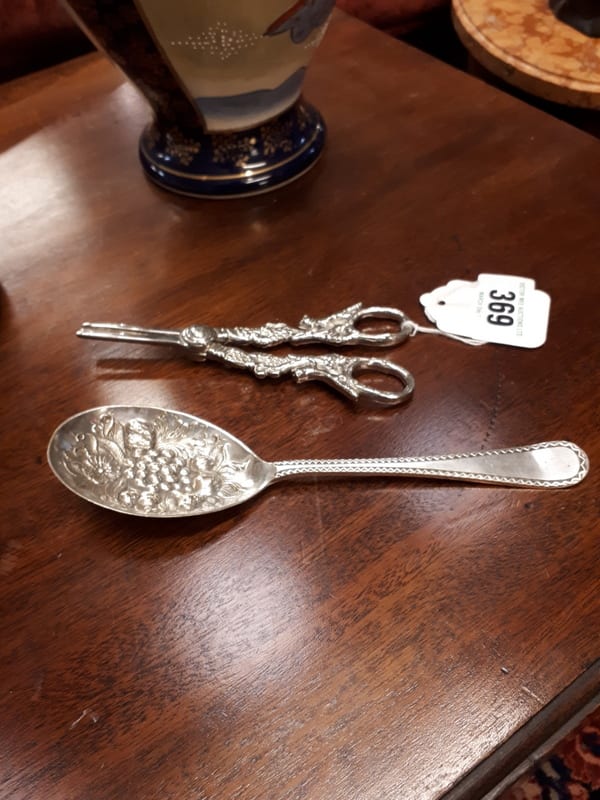 Silver plated berry spoon and pair of silver plated scirrors. sold by Victor Mee Auctions Ltd, lot 369 — auction record photograph