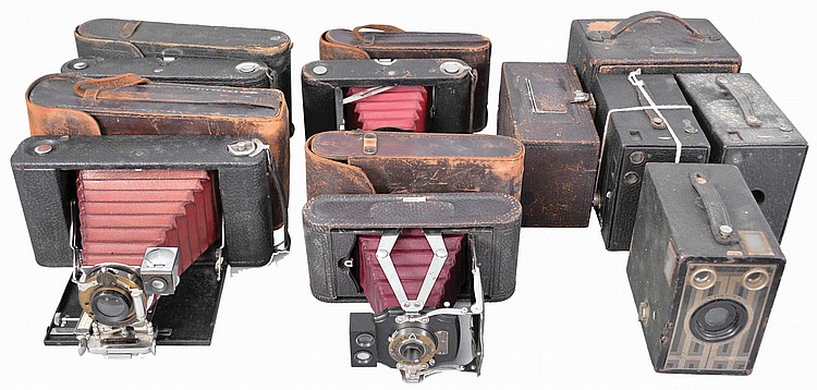 Auction comp thumbnail for Antique Cameras- Large collection of cameras, lenses, and photographic equipment. Many antique cameras including Kodak "Brownie" models, a Kodak "Bantam", "Premo" models, Pentax SLR, film projector in case, a Blair Camera Co., compact model, (Schmitt Horan & Co., Lot 623)