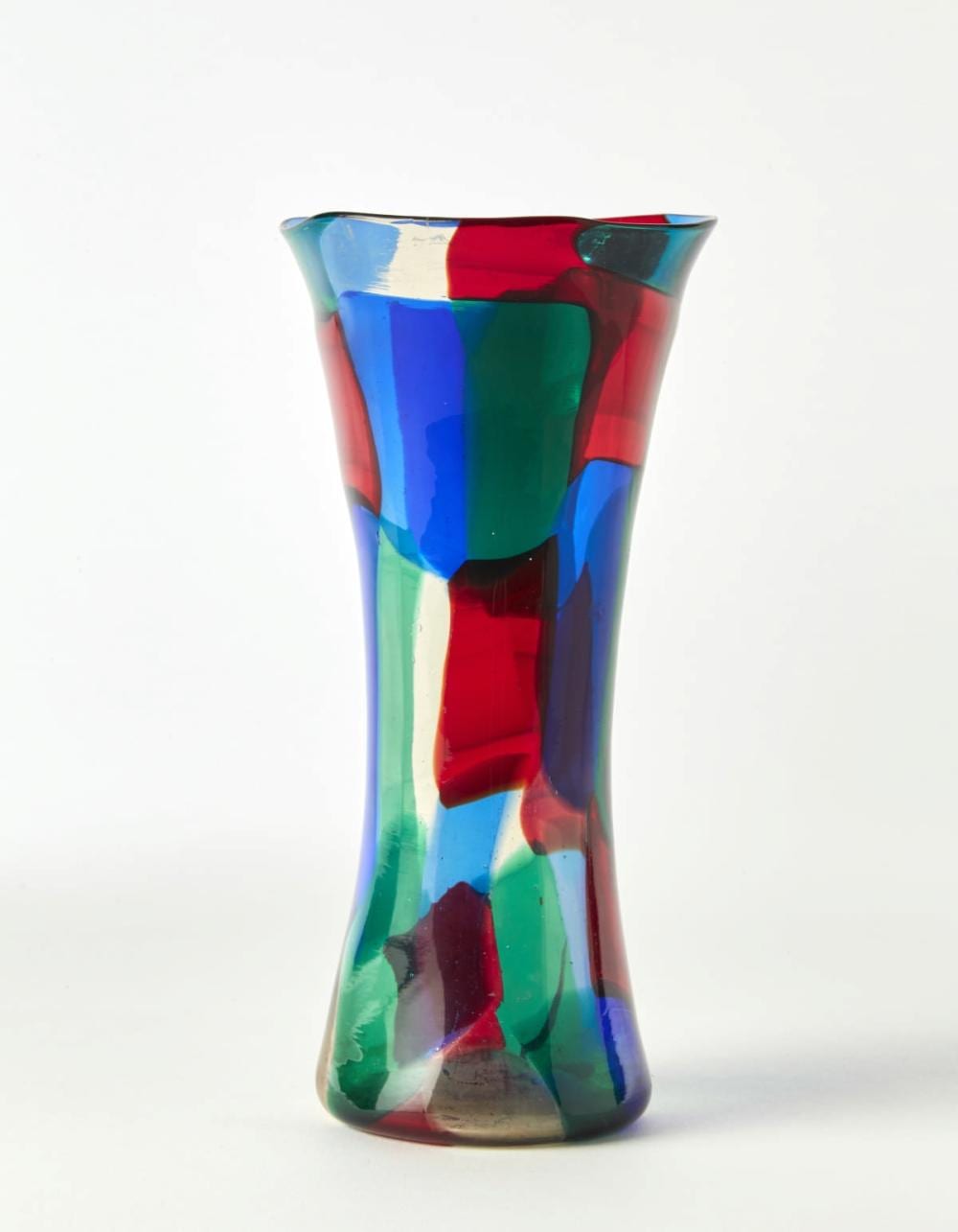 FULVIO BIANCONI (PADOVA 1915 - MILANO 1996)VASE MODEL "PEZZATO". MURANO, 1951CA. BLOWN GLASS VASE WITH TRASPARENT PAGLIQUE, RED, SAPPHIRE AND GREEN APPLICATION (PARIS VARIATION) DRAWING N. 4398 OF THE RED CATALOGUE. SIGNED "VENINI MURANO ITALIA" BEARING THE MANUFACTURING LABEL UNDER THE BASE. (H 23.5 CM.) (MAJOR DEFECTS)LITERATUREFULVIO BIANCONI ALLA VENINI, A CURA DI M. BAROVIER CON C. SONEGO, SKIRA, MILANO 2015, PP. 42, 180, 183VASO MODELLO "PEZZATO". MURANO, 1951CA. VETRO SOFFIATO CON TESSERE TRASPARENTI PAGLIESCO, ROSSE, ZAFFIRO E VERDI (VARIANTE PARIGI). DISEGNO N. 4398 DEL CATALOGO ROSSO. FIRMATO ALL'ASCIDO "VENINI MURANO ITALIA" E RECANTE ETICHETTA ADESIVA DELLA MANIFATTURA SOTTO LA BASE. (H CM 23,5) (GRAVI DIFETTI)BIBLIOGRAFIAFULVIO BIANCONI ALLA VENINI, A CURA DI M. BAROVIER CON C. SONEGO, SKIRA, MILANO 2015, PP. 42, 180, 183 sold by Il Ponte Auction House, lot 357 — auction record photograph
