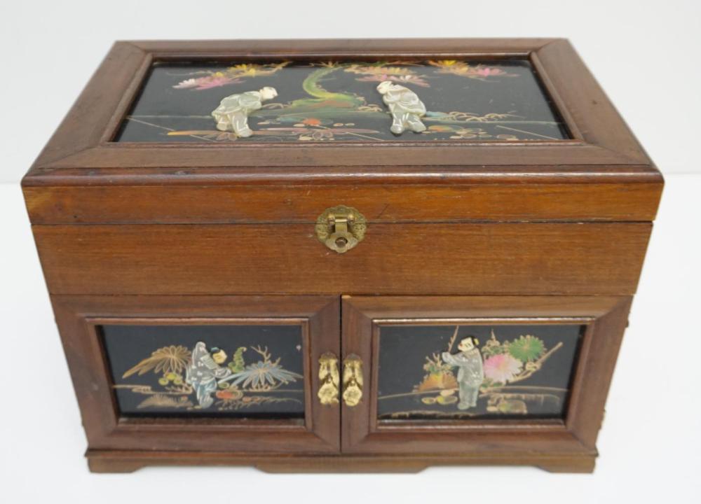 Wooden jewelry box with decorative inlaid panels on the front and lid, featuring floral and figure motifs, and a brass latch.