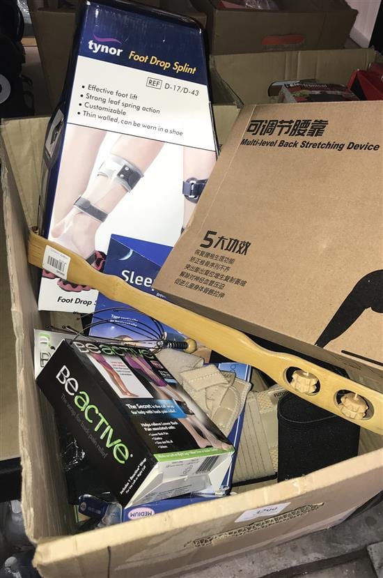A. Pain comparable auction result: a box of remedial pain relief accessories