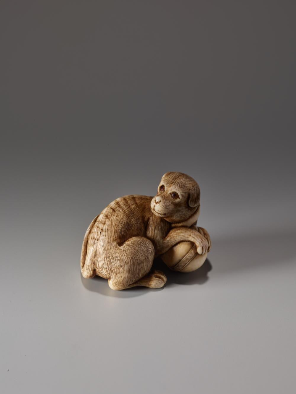Ikko Narahara comparable auction result: an ivory netsuke of a dog with a ball by ikko