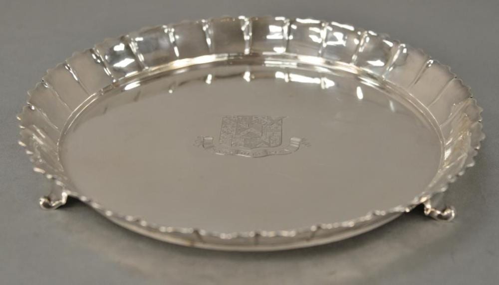 Paul de Lamerie comparable auction result: paul de lamerie 1688 1751 silver strawberry dish circa 1739 having scalloped sectioned edge set on scrolled feet with family
