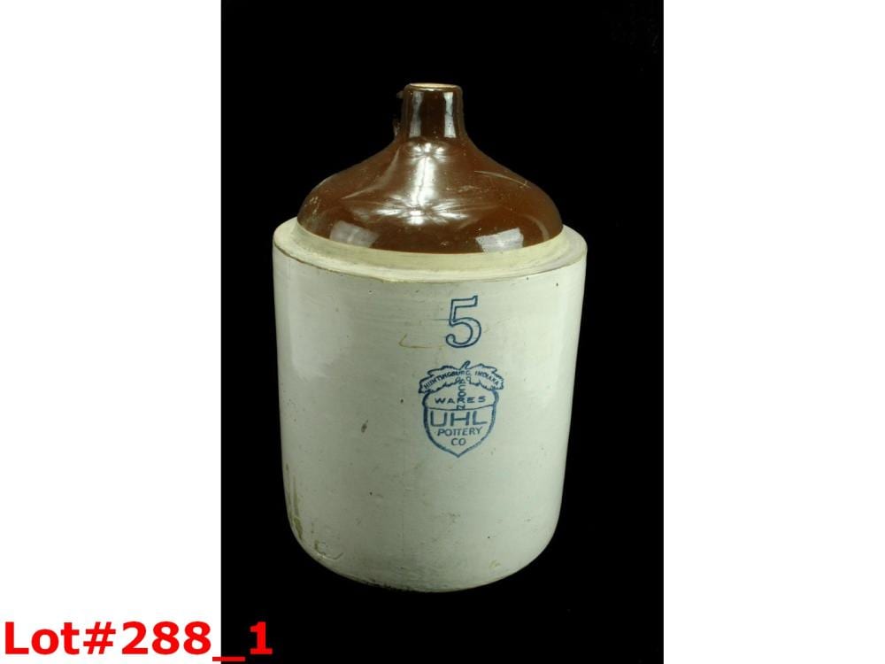 White stoneware jug with a brown neck and shoulder glaze, marked with a blue “5” and a blue stamp label.