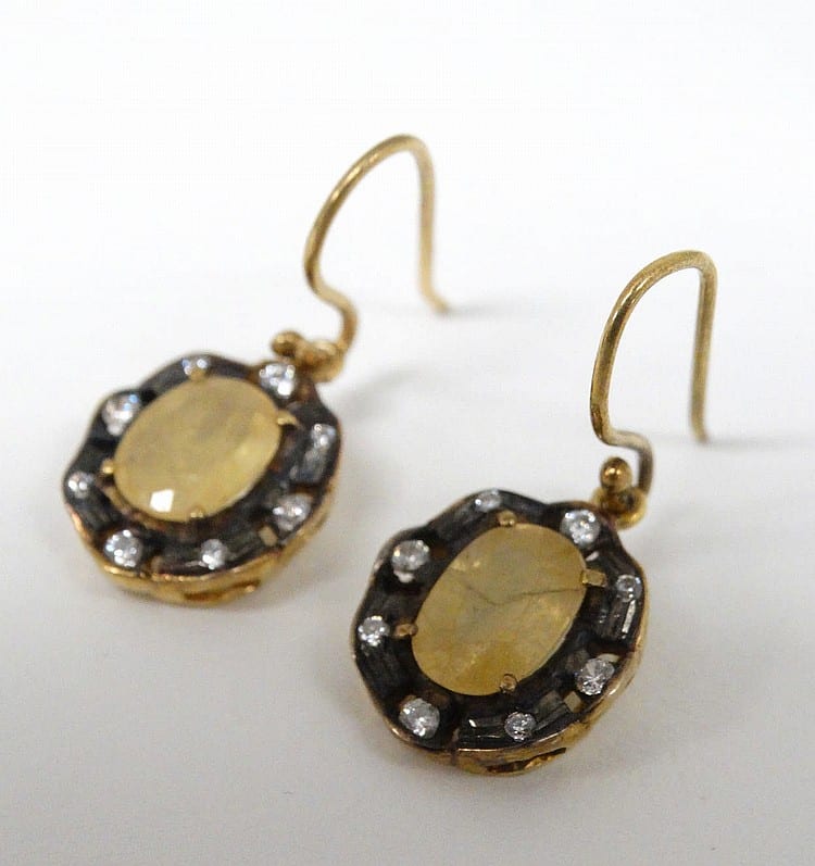 F. Gold comparable auction result: a pair of gold and gilt metal drop earrings set with yellow semi precious f