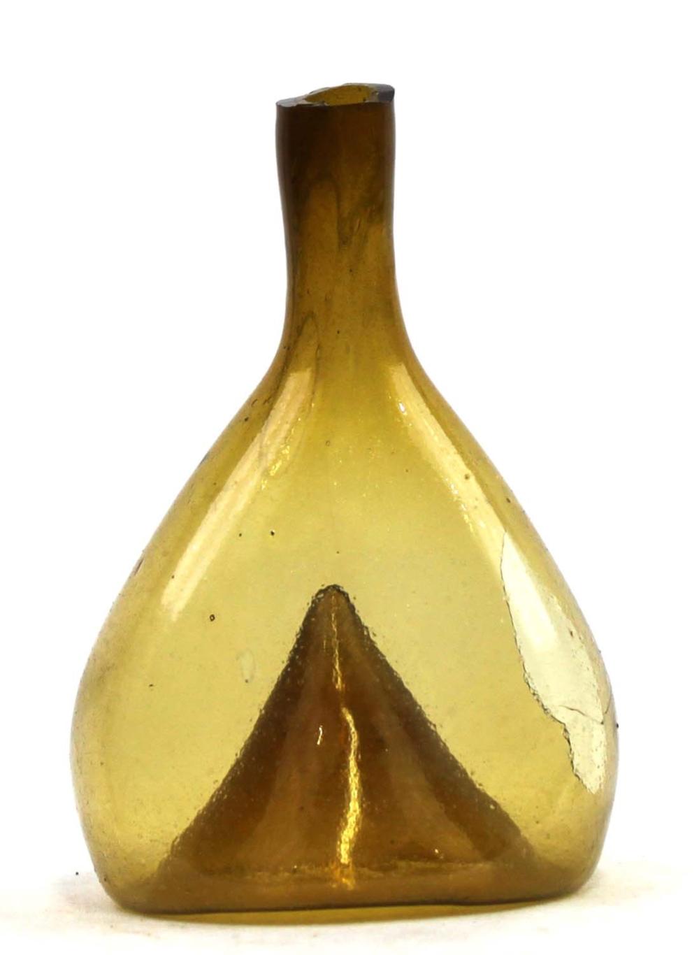 Antique-style glass wine bottle with amber color and a narrow neck, shown against a white background.