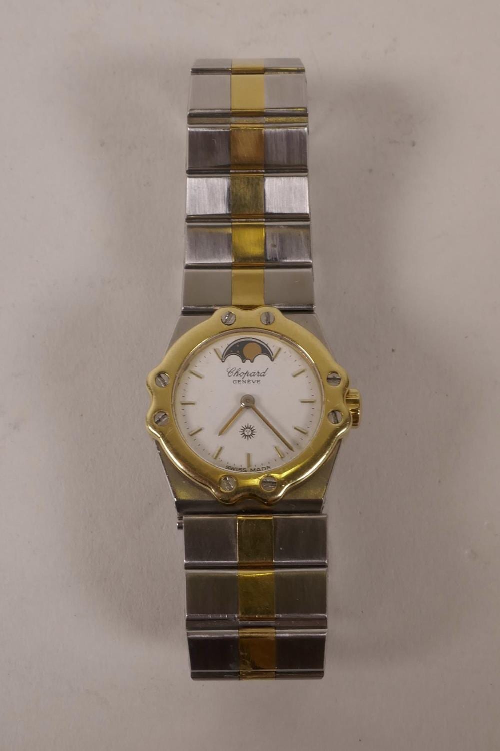 A. Chopard comparable auction result: a lady s chopard yellow metal and steel cased wristwatch