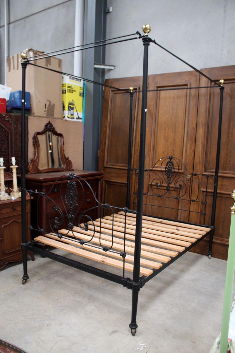 Antique cast iron and lace four post canopy bed, approx 232cm H x 188cm L x 138cm W sold by Vickers & Hoad, lot 387 — auction record photograph