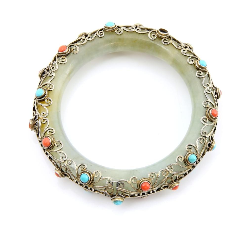 a jade bangle overlaid with white metal filigree d · Ewbank's · 2019-06-19 D. White comparable auction result: a jade bangle overlaid with white metal filigree d