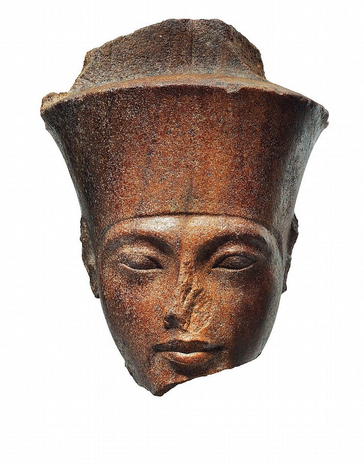 An Egyptian Brown Quartzite Head Of The God Amen With The Features Of The... New Kingdom, 18TH DYNASTY, REIGN OF TUTANKHAMEN, CIRCA 1333-1323 B.C. 11 ¼ in. (28.5 cm.) high comparable sale
