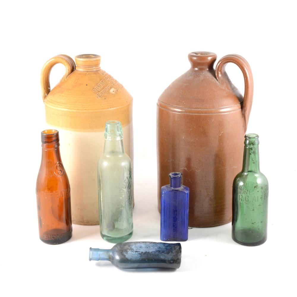 A tray of old antique glass bottles to include blue poison bottles, Hunt Ed sold by Gildings Auctioneers, lot 108 — auction record photograph