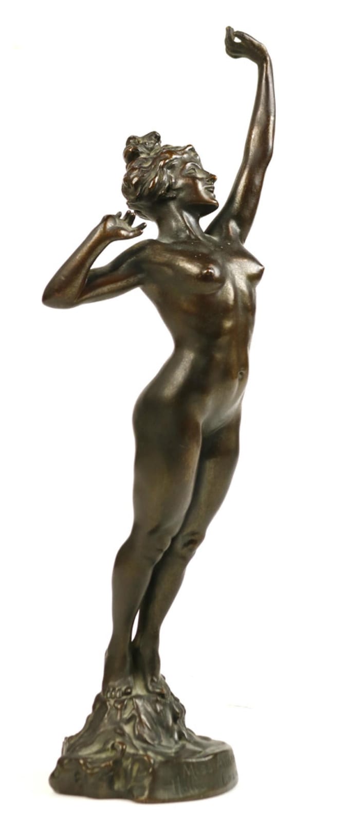 Bronze-toned sculpture of a nude female figure standing with one arm raised.