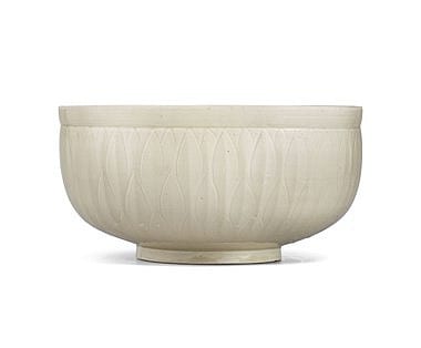 A Very Rare Large Ding Carved 'Fish' Bowl Northern Song-Jin Dynasty (960-1234) 13 in. (33 cm.) diam. comparable sale
