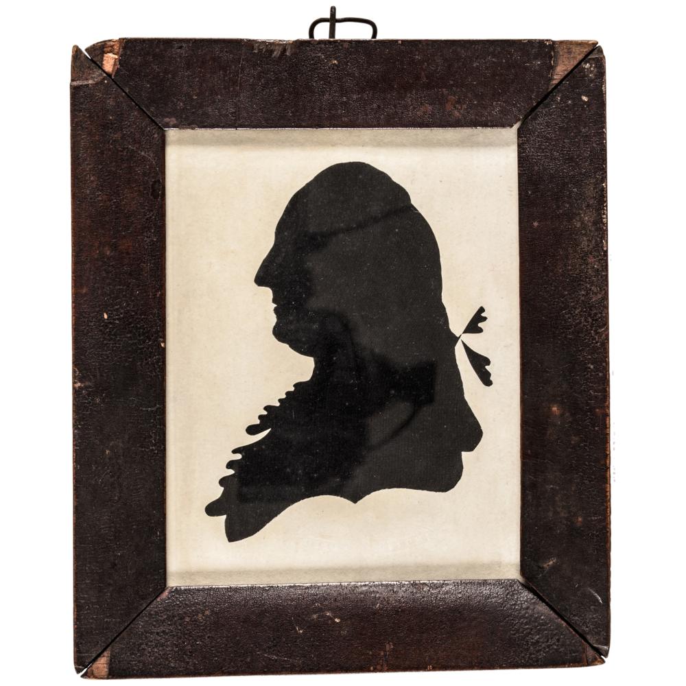 Silhouette portrait of a man in profile wearing a hat and coat, set in a dark rectangular frame.