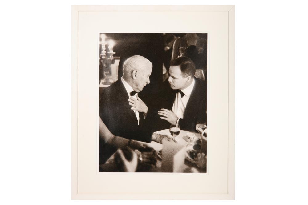 Alain Nogues comparable auction result: marlon brando and charlie chaplin having dinner by alain nogues