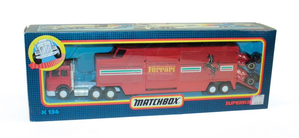 Matchbox Superkings Ferrari red car transporter toy in its blue retail box with “Ferrari” and “MATCHBOX” branding.