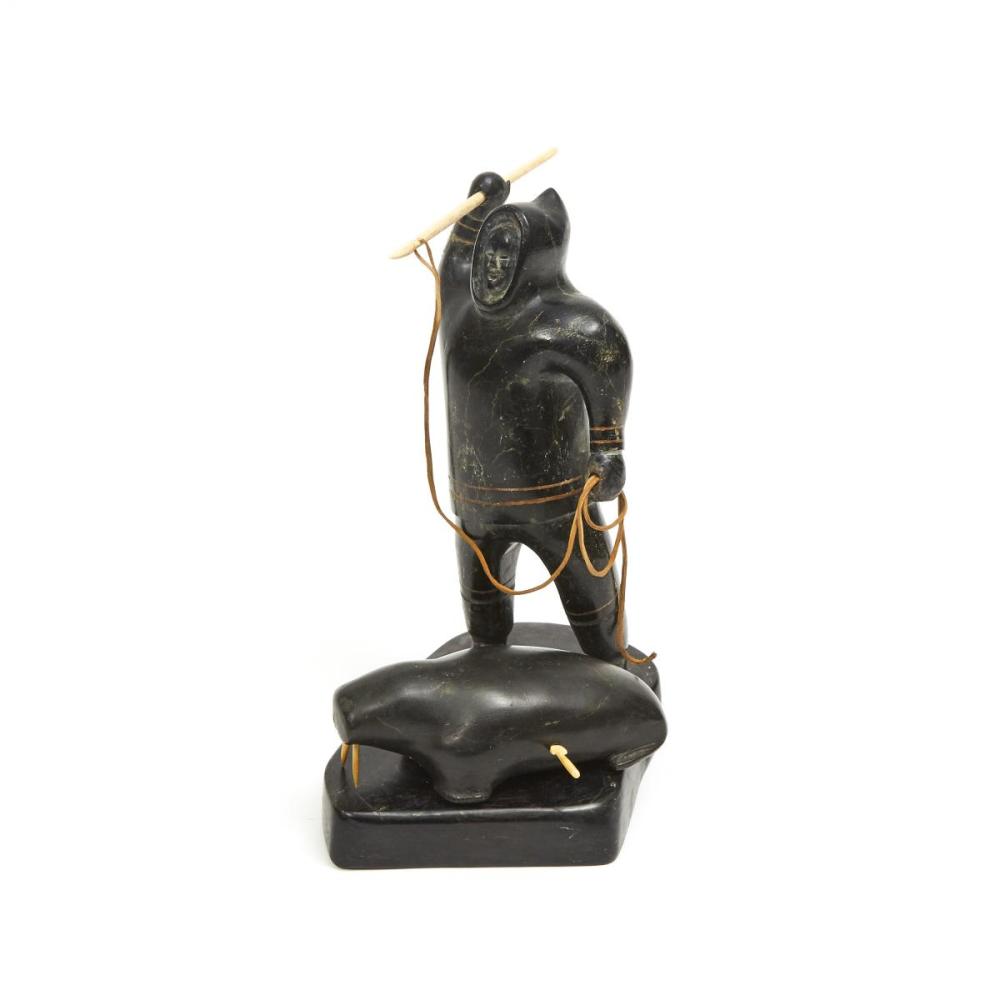Akeeaktashuk comparable auction result: akeeaktashuk 1898 1954 hunter and walrus stone ivory 8 75 x 7 x 5 5 in 22 2 x 17 8 x 14 cm