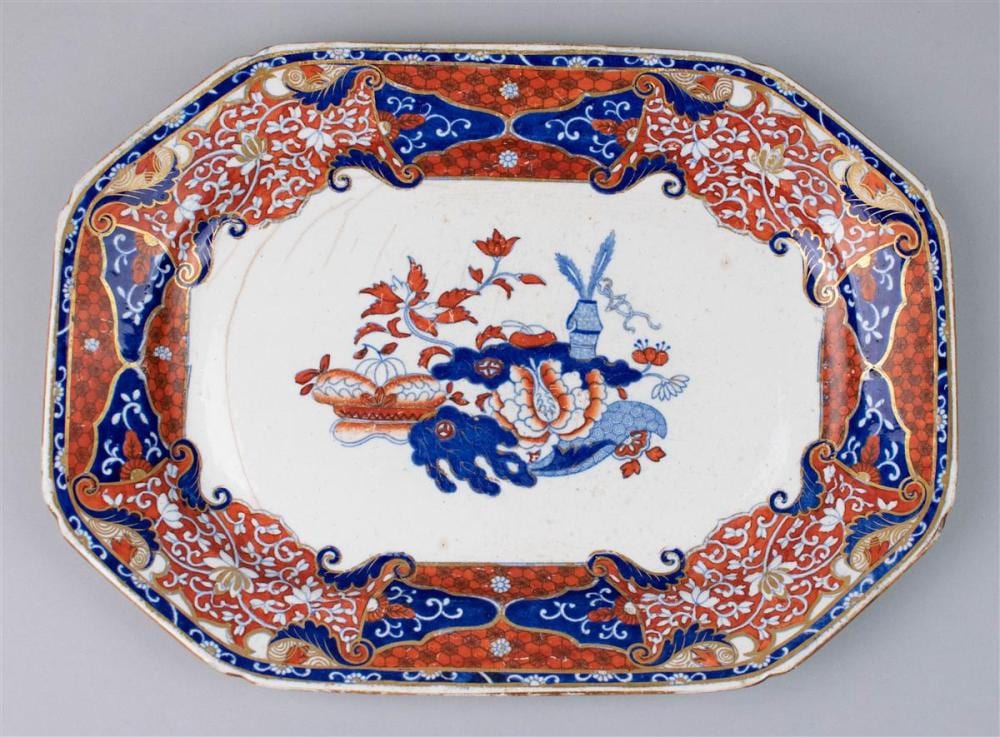 Rectangular decorative porcelain platter with blue, red, and white floral and scroll border and a central bird and fish motif.